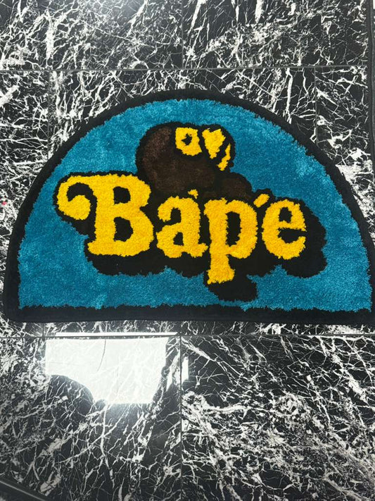 APE Logo Half-Moon Rug — Teal & Yellow